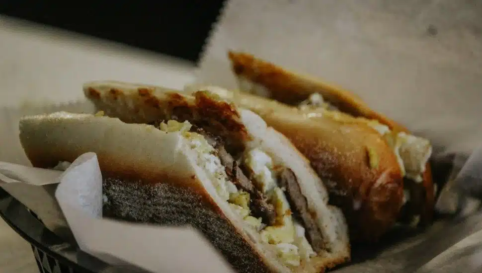 A long breakfast sandwich from Fat Boy's deli filled with 3 Farm Fresh X Large Eggs, double meat and double cheese.
