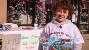 Calvin Grasso collecting toys so that other kids can have a happy holiday.