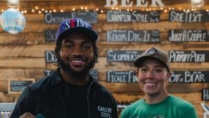 Eagles player D’Andre Swift at Bald Birds Brewing with owner Abby Feerrar.