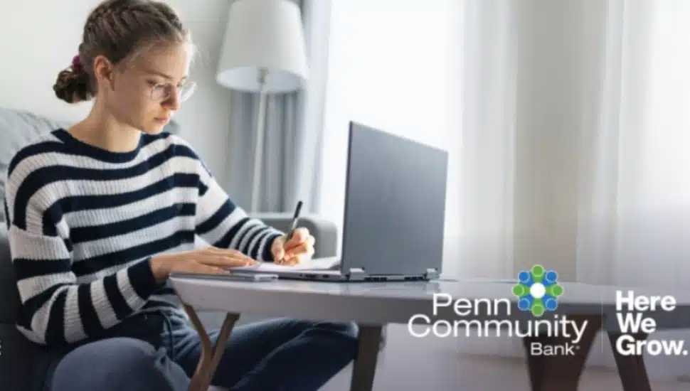 A woman on a laptop.