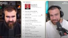 Kelce brothers Jason and Travis show an iTunes chart with "Fairytale of Philadelphia" No. 1 during a New Heights podcast.