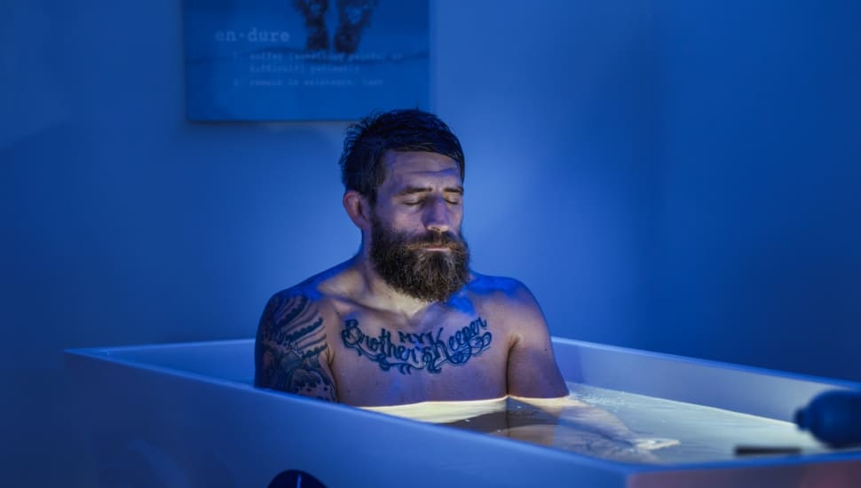 A man taking a cold plunge at Warrior's Garden Spa & Recovery in Jenkintown.