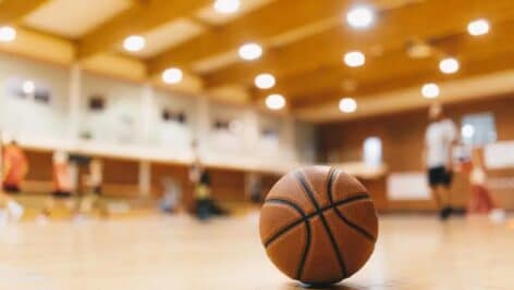 A photo of a basketball on a court.