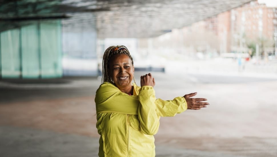 Let's get moving! A woman performs some movment exercises. Let's get moving!