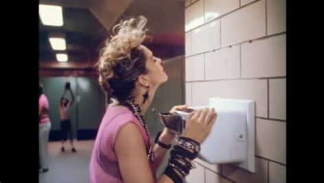 Madonna drying her hair in a Desperately Seeking Susan scene.