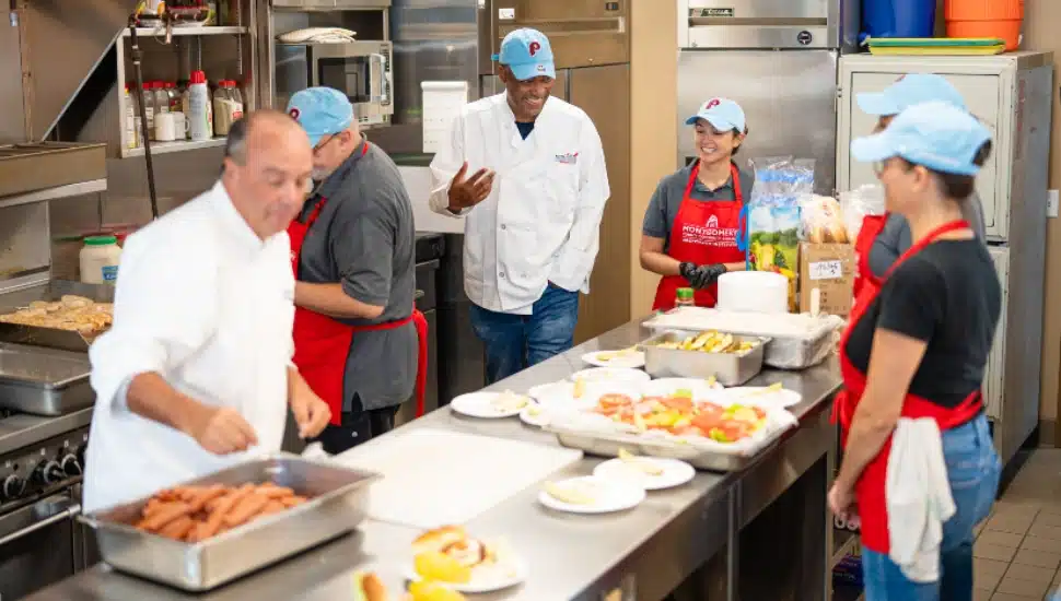People working in a kitchen.