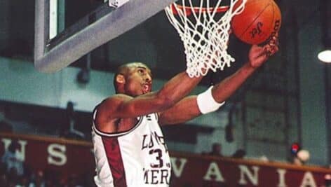 Kobe Bryant dunking the ball in the net while playing for Lower Merion High School.
