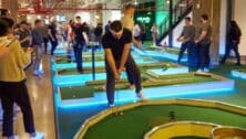 People playing mini golf.