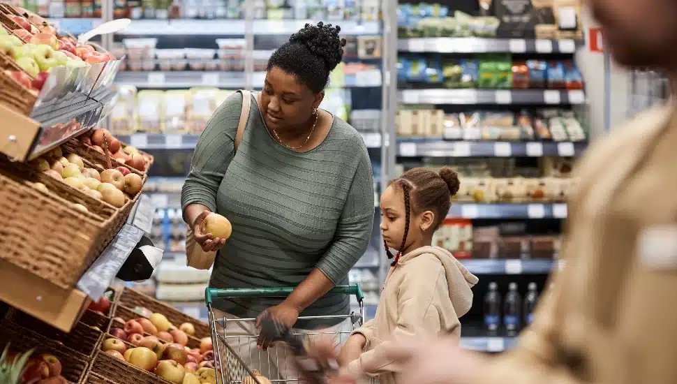 Mother and daughter grocery shopping