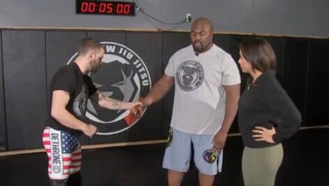 Omar Cruickshank (center) shows 6abc's Alyana Gomez some self-defense moves with the help of Steve Westergom.