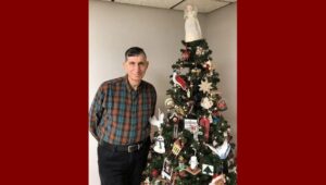 Skippack’s Vince Cioffo posing with Christmas tree.