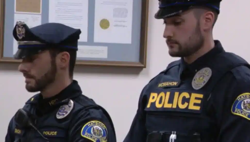Officer Aaron Simon and Rob McMahon.