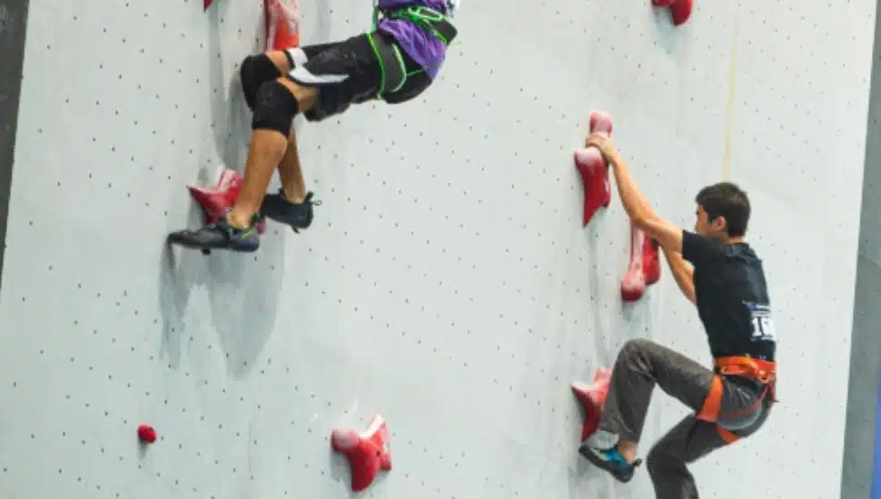People rock climbing.