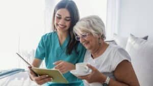 An Affinity Healthcare Solutions Care Ambassador with a patient.