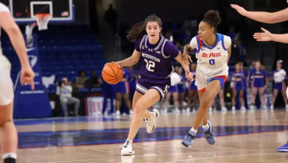 Casey Harter playing basketball for Northwestern.