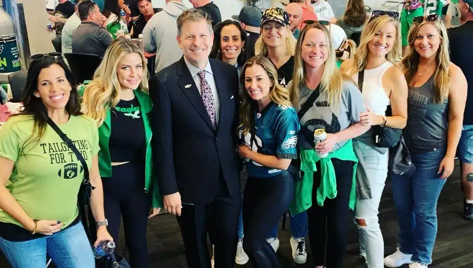 Christian Molnar poses with fans before an Eagles game