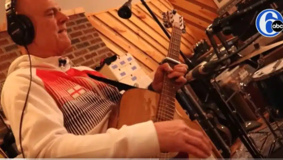 Tommy Conway playing guitar.