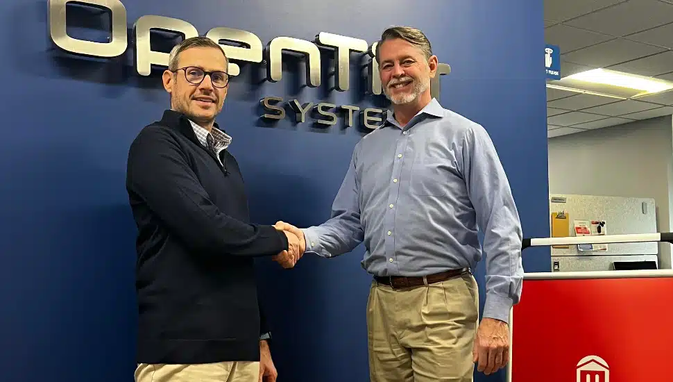 Brian McCarthy Jr., president/partner, Open Tier Systems of Blue Bell (left) shakes hands with Lawrence Byron, Montgomery County Community College Director of Workforce Development for Information Technology. Open Tier and the Montgomery County Intermediate Unit-Office of Technology Services of Norristown (not pictured) are collaborating with MCCC as part of the launch of its new MontcoWorks Apprenticeship Program for Information Technology.