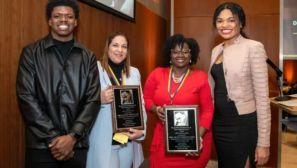 WCU’s MLK Brunch student co-host Josef Sanders, Drum Major for Justice Milena Oberti Lanz M’13, Drum Major for Justice Nicole Barkley-Jones ’99, and MLK Brunch student co-host Journey Washington.
