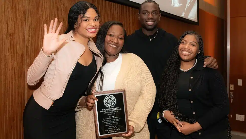 Journey Washington, student co-host of the MLK Brunch, with ECAY members Mya Hill, Perez Abhuilmen, and Kyanna Randolph (president).