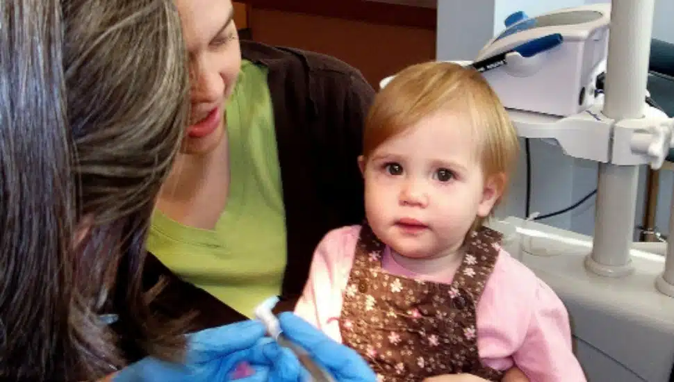 A small child receiving dental care at CHDC.