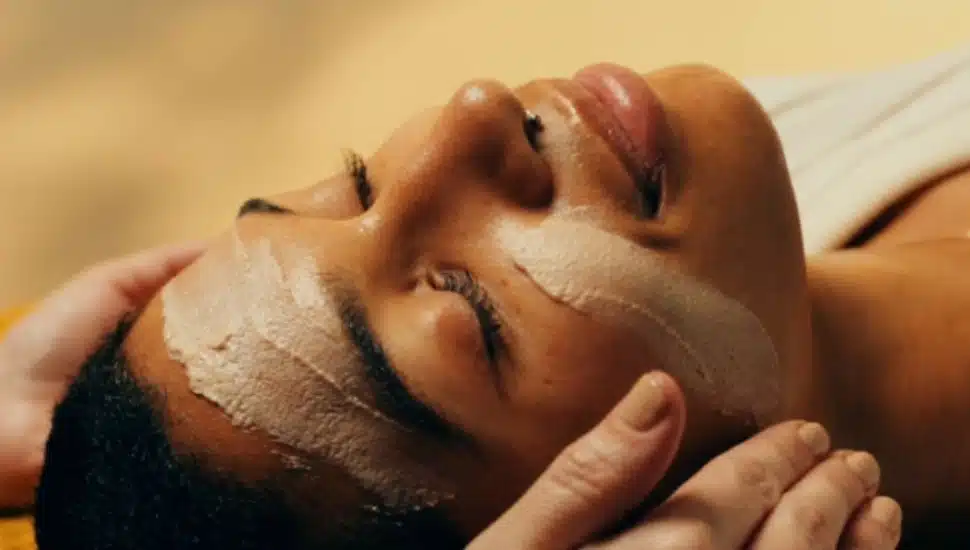 A woman receiving a facial.