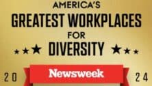 Signage about Newsweek's diversity in the workplace listing.