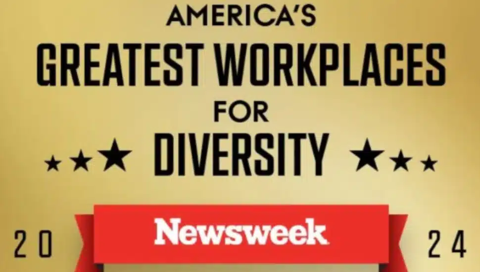 Signage about Newsweek's diversity in the workplace listing.