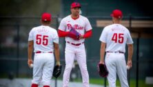 Philadelphia Phillies players on the field talking.