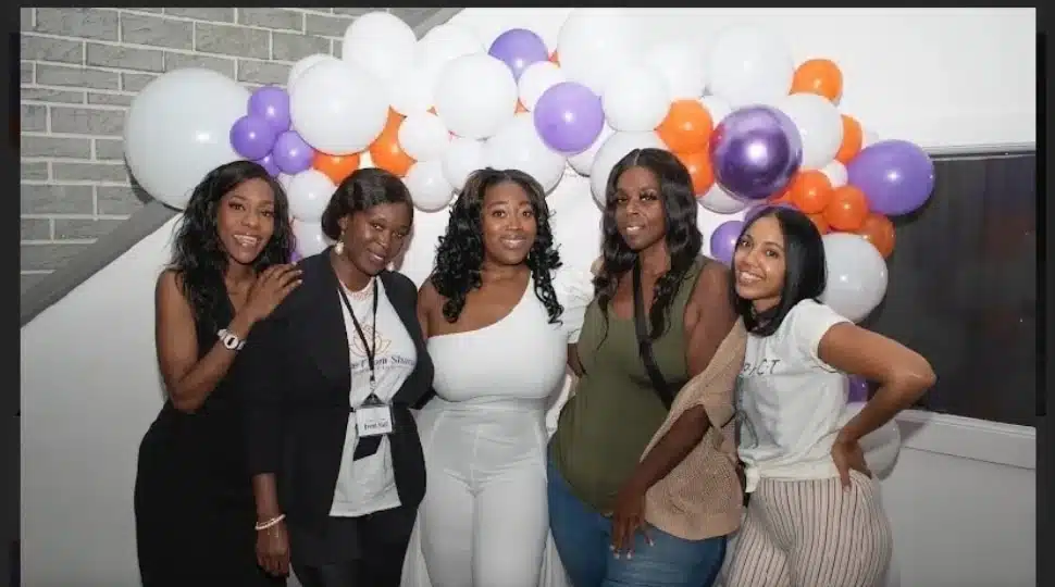 Women involved with A Home from Shana Foundation celebrate.