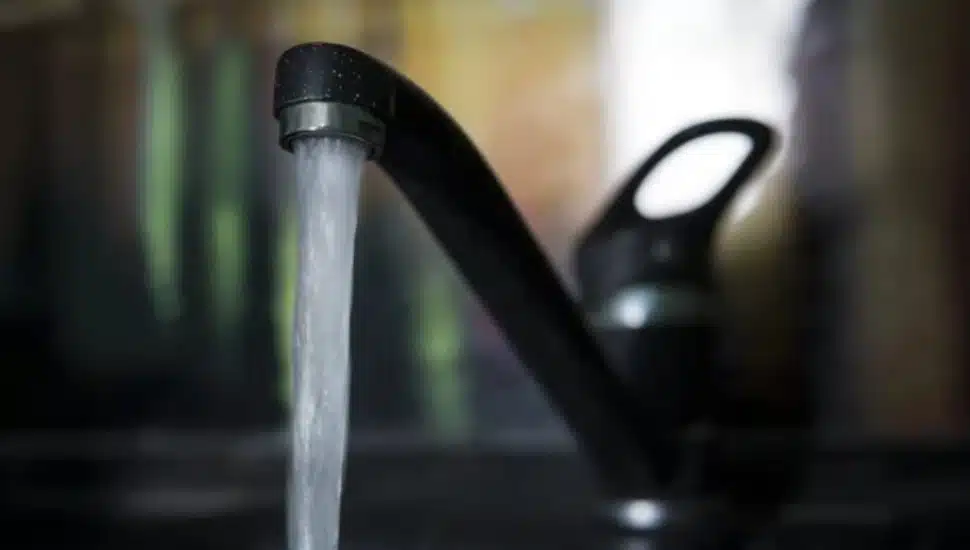 Water dripping out of faucet.