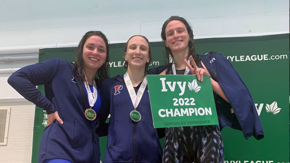 Anna Kalandadze (left) stands with the 2022 Penn women’s swimming team. With her are Catherine Buroker, and Lia Thomas.