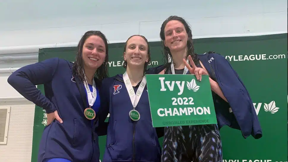 Anna Kalandadze (left) stands with the 2022 Penn women’s swimming team. With her are Catherine Buroker, and Lia Thomas.