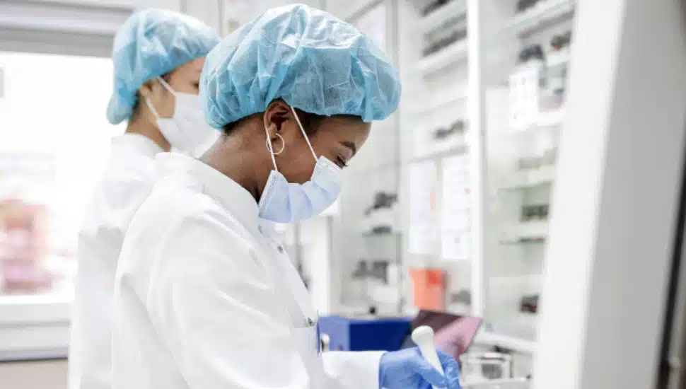 Two people working in a lab.