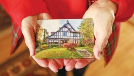Eileen DiFranco holds a photograph of her old home in East Mount Airy.