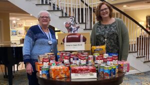 Nancy Brown, Concierge (left) and Kim Ranck, Community Life Services Director (right). Nancy Brown, Concierge (left) and Kim Ranck, Community Life Services Director (right) with donated items for Soup for the Super Bowl', a fundraising event for the Chester Food Bank.
