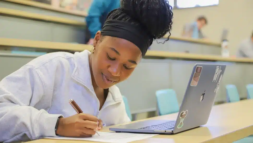 student in classroom working.