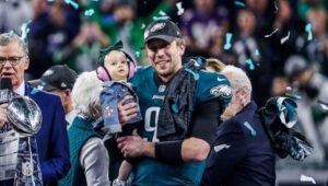 Nick Foles holds daughter as confetti falls after winning the 2018 Super Bowl.