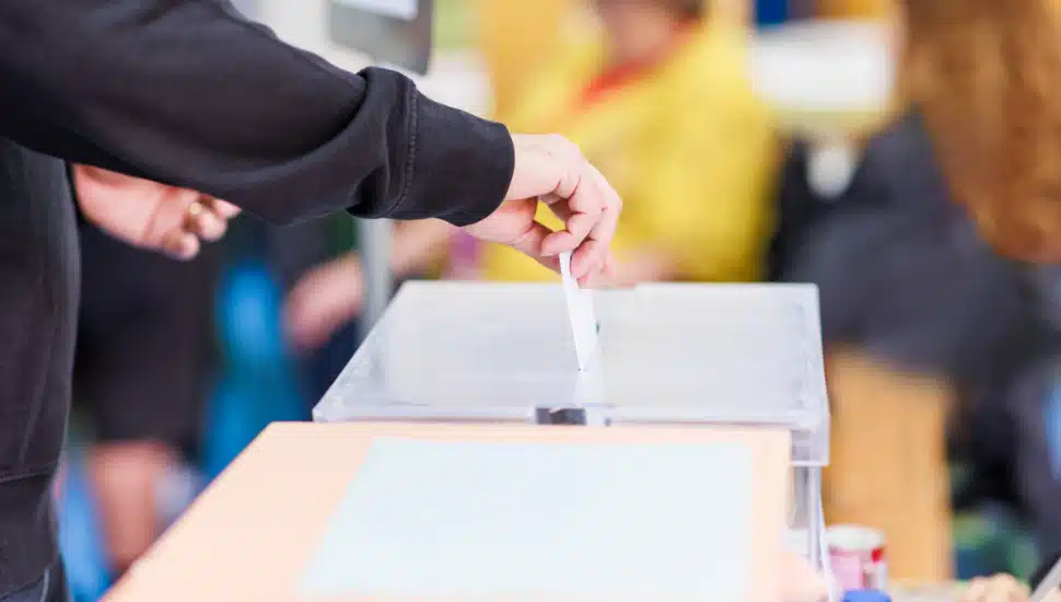Voting candidate campaign in democracy ballot box.