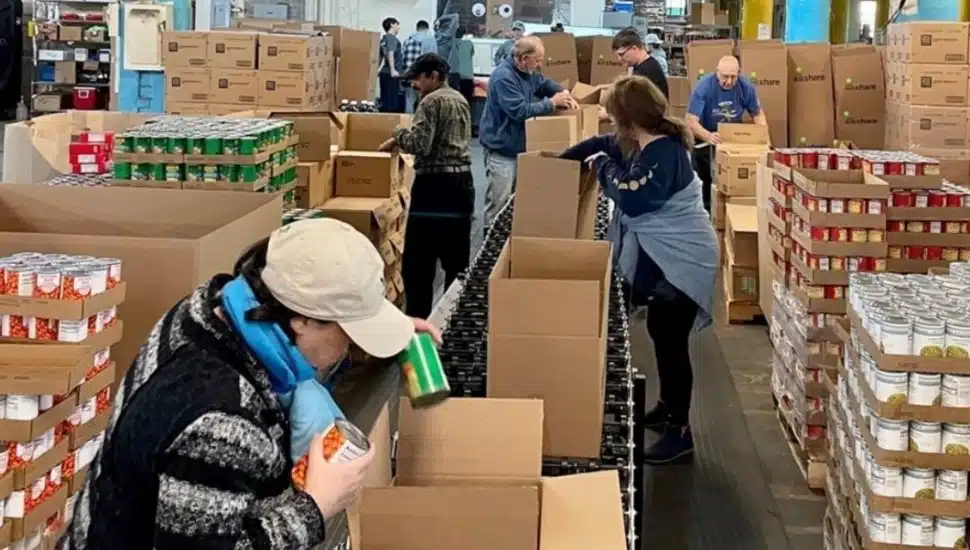 People packing up food for delivery.