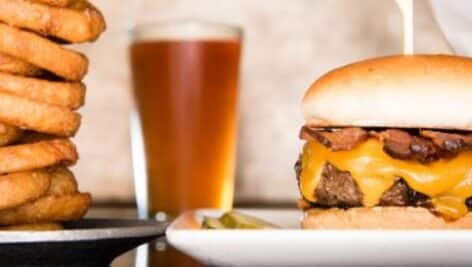 close-up photo of beer and cheeseburger.