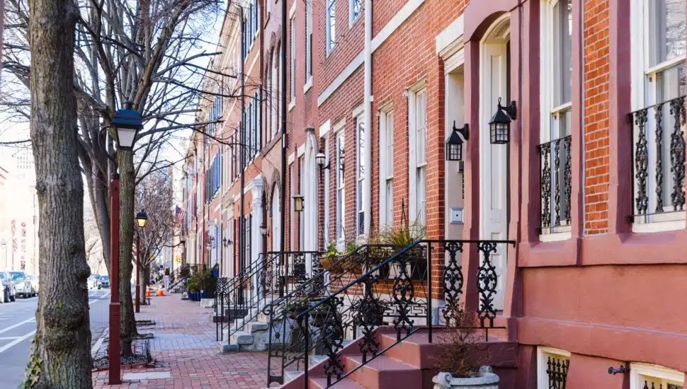 Rows of brownstone apartment buildings in Center City with windows, stoops and planters in Pennsylvania
