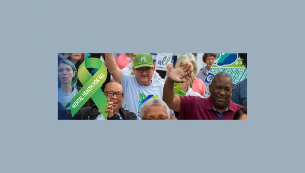 Participants holding "Mental health for all" banner at NAMIWalks
