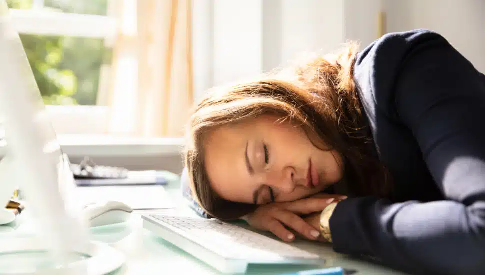 Women sleeping at her desk