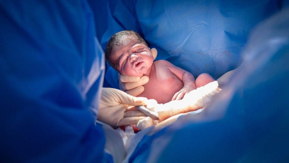Baby being born
