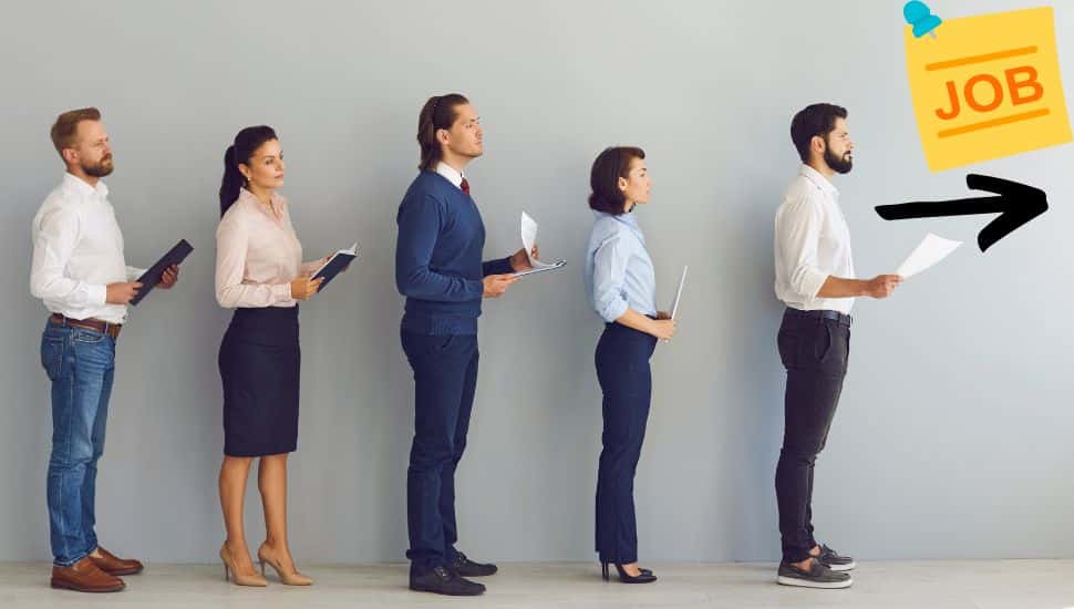 Line of people holding their resume waiting to be interviewed