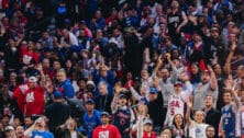 Sixers fans cheering for the team.