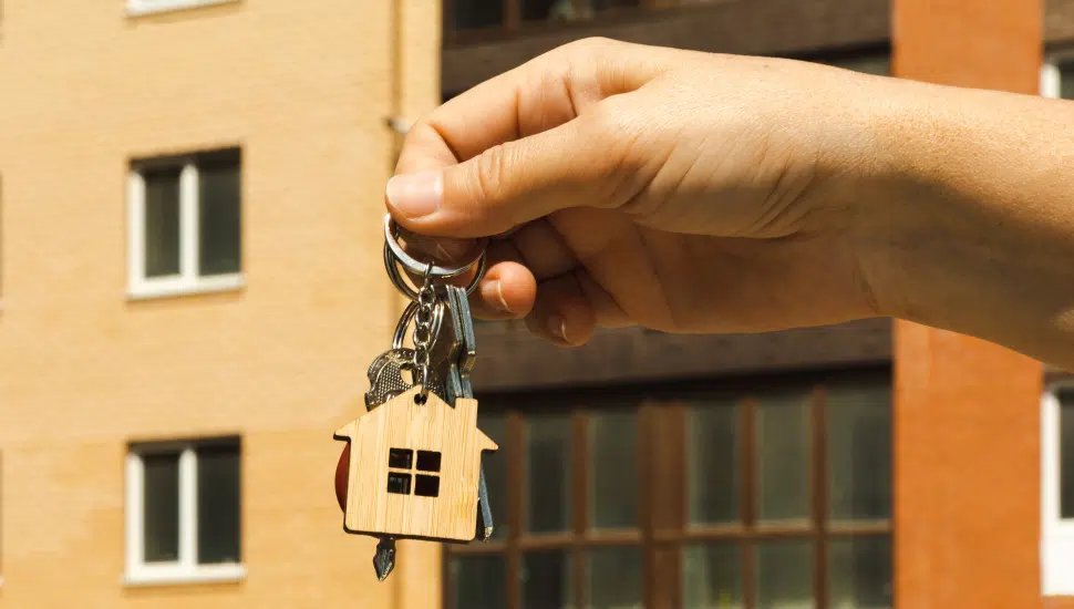 person holding house keys
