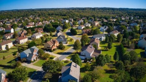 an upscale suburbs with golf course houses and roof tops