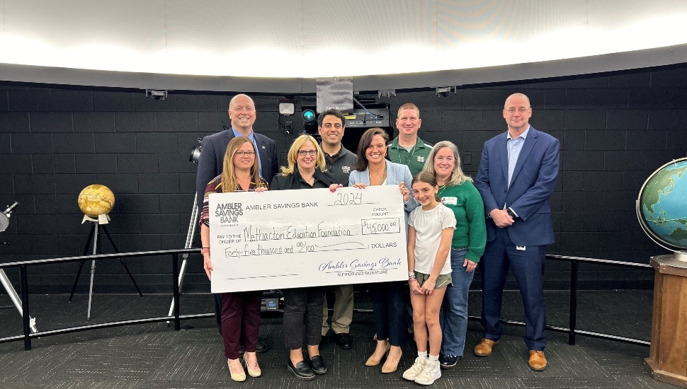 Members of Ambler Savings Bank and Methacton's Arcola Intermediate School holding a check for $45,000 to fund a new plasma cutter and planetarium upgrades.